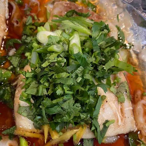 Baked fish in an aluminum foil